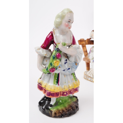 52 - A collection of vintage 20th century German porcelain Lao figurines and Staffordshire. To include th... 