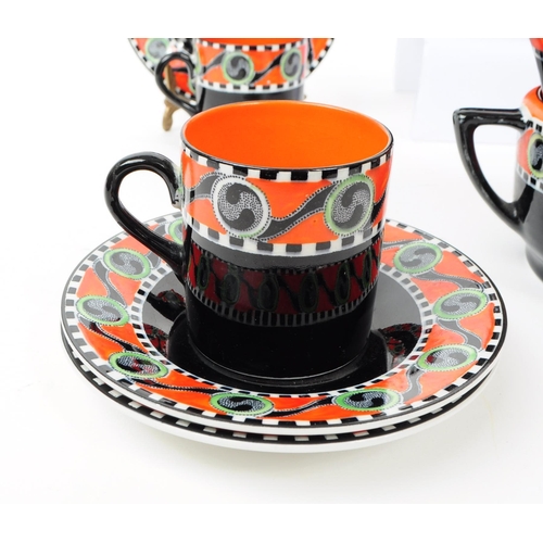 57 - Soho Pottery - Solian Ware - An Art Deco porcelain china coffee service. To include cups, saucers, m... 