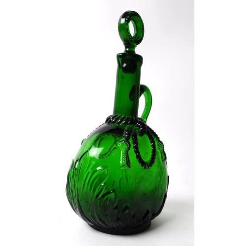 71 - Victorian 19th century green glass wine decanter with stopper. Of ovoid form with foliate relief to ... 