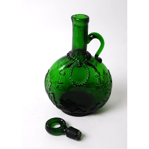 71 - Victorian 19th century green glass wine decanter with stopper. Of ovoid form with foliate relief to ... 