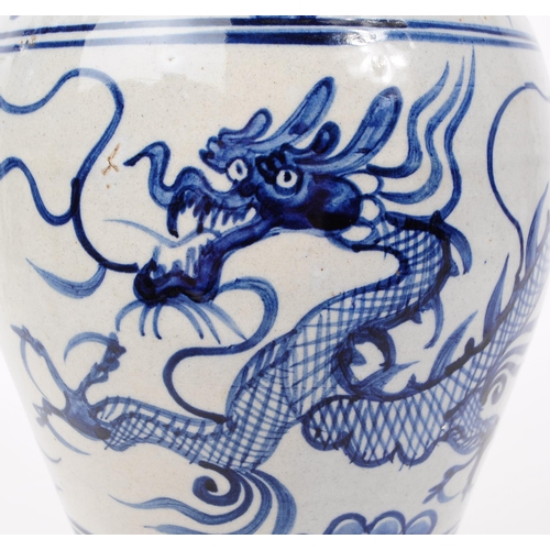 73 - 19th century Meiping blue and white dragon stem / bud vase. Narrow base into a bulbous top with narr... 