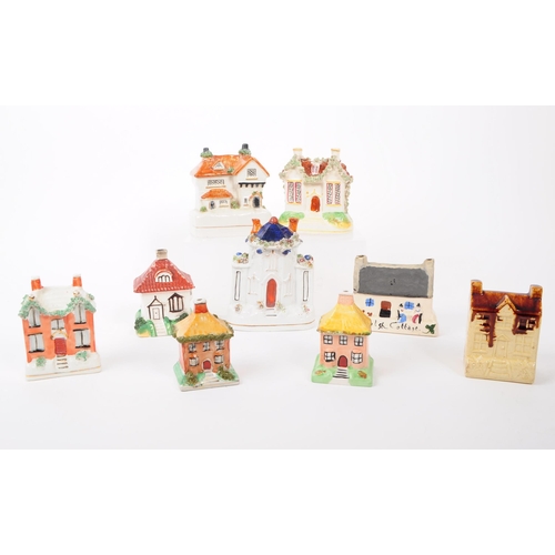 8 - A collection of 19th and 20th century ceramic cottages. The collection to include a selection of dif... 