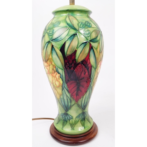 81 - Moorcroft Pottery - Two hand painted ceramic ' rainforest ' pattern iems. The lot to include a ceram... 