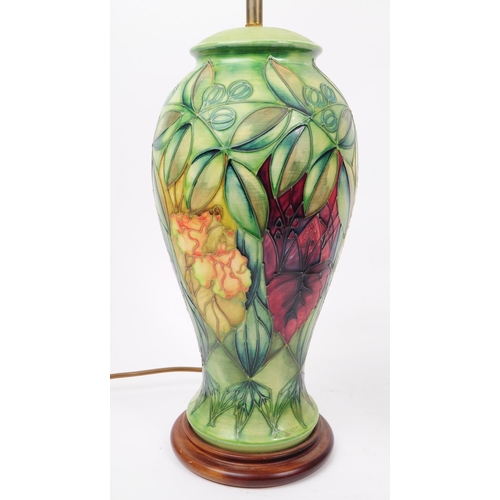 81 - Moorcroft Pottery - Two hand painted ceramic ' rainforest ' pattern iems. The lot to include a ceram... 