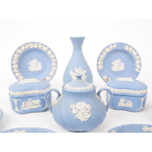 87 - A collection of vintage Wedgwood Jasperware bisque porcelain items. The lot to include five coffee s... 