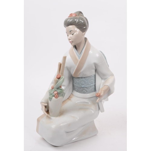 90 - LLadro, Spain - A large hand painted fine bone china porcelain figure of kneeling geisha. The figure... 