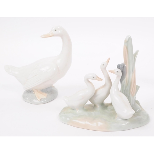 91 - LLadro & Nao by Lladro - A collection of eight hand painted fine bone china porcelain figures of... 