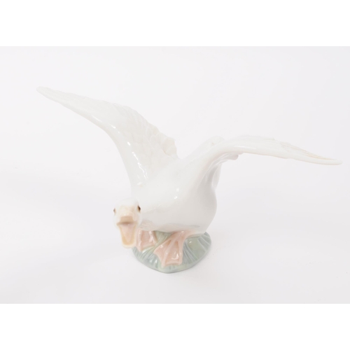 91 - LLadro & Nao by Lladro - A collection of eight hand painted fine bone china porcelain figures of... 