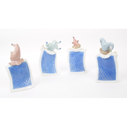 92 - Nao for Lladro, Spain - a full set of four hand painted fine bone china porcelain figures of childre... 