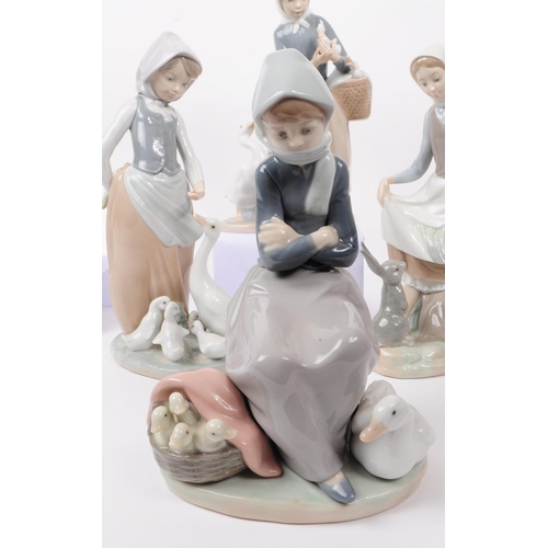 94 - LLadro, Spain - a collection of six hand painted fine bone china porcelain figures of ladies with fa... 