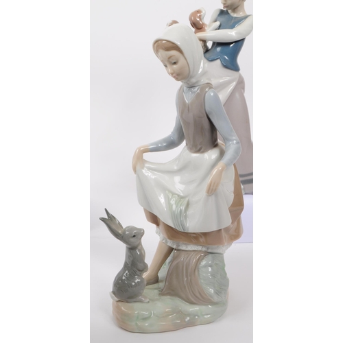 94 - LLadro, Spain - a collection of six hand painted fine bone china porcelain figures of ladies with fa... 