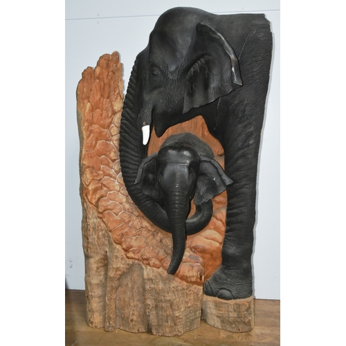 243 - Former Bristol Zoo Gardens - Elephants (Unknown Artist) - a large carved hardwood sculpture of two e... 