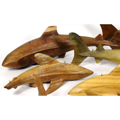 47 - Former Bristol Zoo Gardens - a collection of x7 carved hardwood shark sculptures. Each neatly carved... 