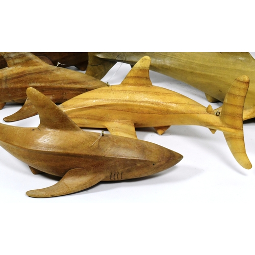 47 - Former Bristol Zoo Gardens - a collection of x7 carved hardwood shark sculptures. Each neatly carved... 