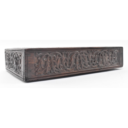 106 - An Indian 19th century carved wooden dowry / jewellery box. The box having an intricately carved sli... 