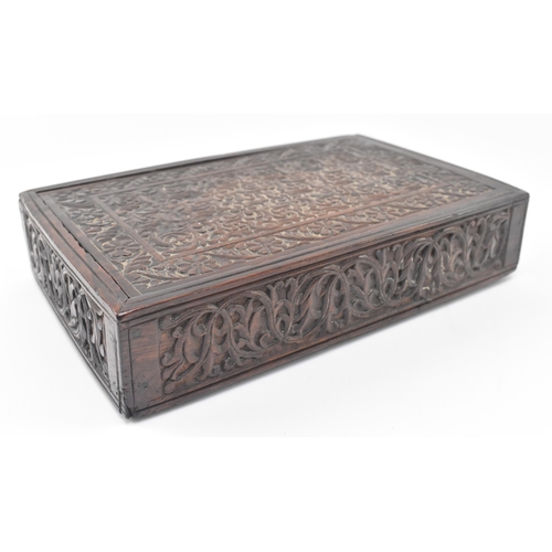 106 - An Indian 19th century carved wooden dowry / jewellery box. The box having an intricately carved sli... 