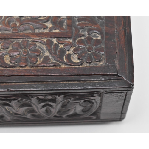 106 - An Indian 19th century carved wooden dowry / jewellery box. The box having an intricately carved sli... 