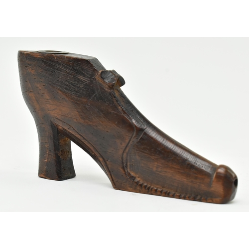 107 - An early to mid 19th century carved treen wooden snuff box in the form of a shoe. The shoe in a 17th... 