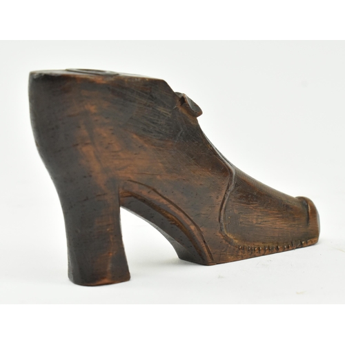 107 - An early to mid 19th century carved treen wooden snuff box in the form of a shoe. The shoe in a 17th... 