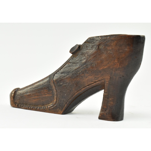 107 - An early to mid 19th century carved treen wooden snuff box in the form of a shoe. The shoe in a 17th... 