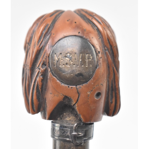 109 - An early 20th century wooden walking stick pommel carved as the head of a dog. The pommel having a c... 