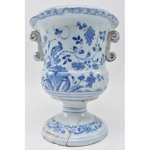 116 - A late 18th century English Delft style blue and white tin glazed campana urn pot with twin handles.... 