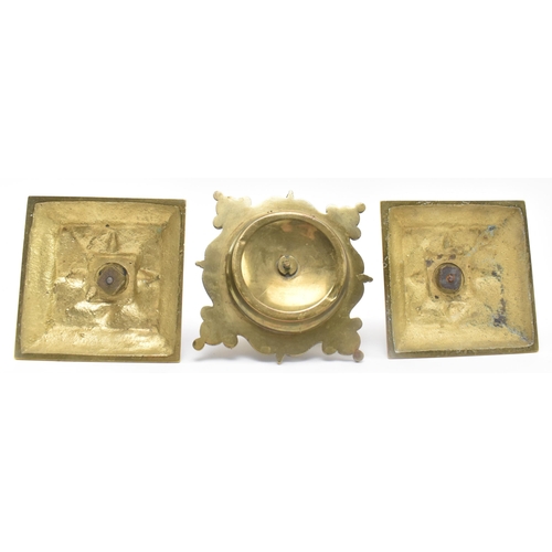 121 - A pair of late 19th century Victorian square brass candlesticks, together with a similar lidded inkw... 