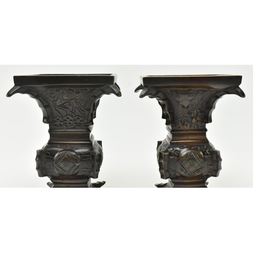 125 - A pair of Japanese 19th century bronze Gu form archaic flower vases. Each having a squared mouth ove... 