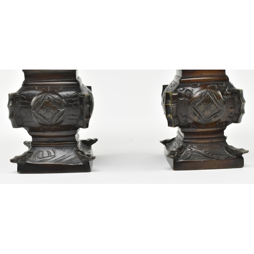 125 - A pair of Japanese 19th century bronze Gu form archaic flower vases. Each having a squared mouth ove... 