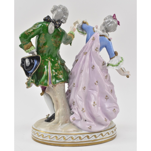 127 - Sitzendorf - an early 20th century porcelain figural group depicting a Regency couple dancing. Each ... 