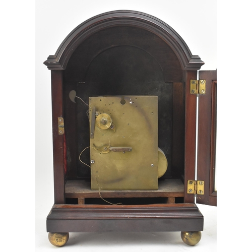 128 - A late 18th century single fusee mantle clock. The clock cased in flame mahogany, with steel engrave... 