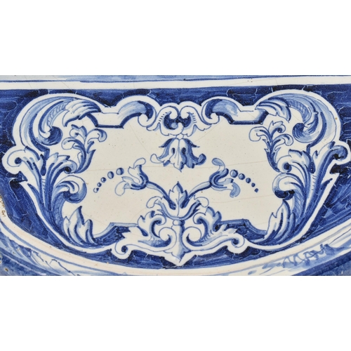 14 - A Dutch Delft 18th century white & blue glazed ceramic wall plaque. The shaped plaque having ste... 