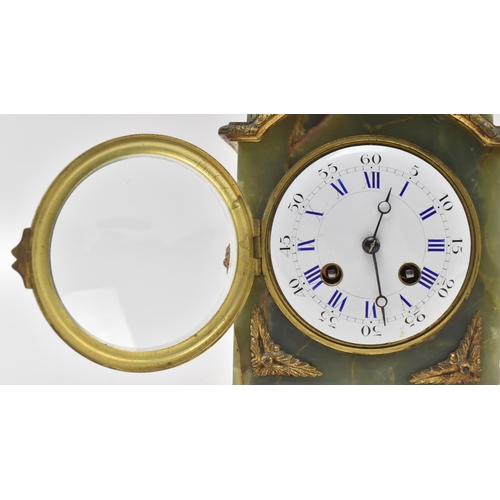 140 - A French continental early 20th century green onyx & brass mounted eight-day mantle clock. The c... 