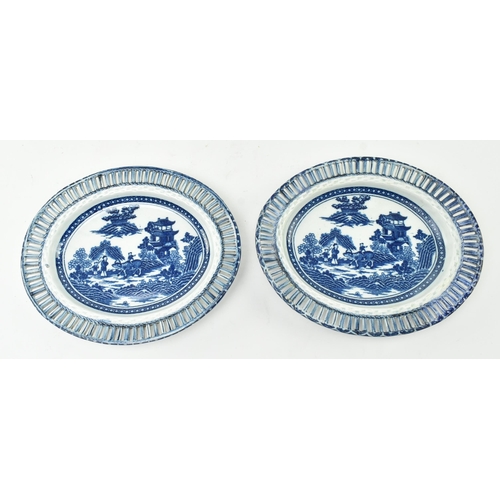 143 - Caughley - a pair of late 18th century Regency blue and white Chinoiserie dishes with lattice work d... 