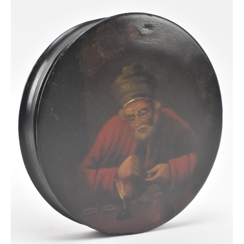 144 - A late 18th - early 19th century hand painted papier mache lacquered snuff box. The circular box pai... 