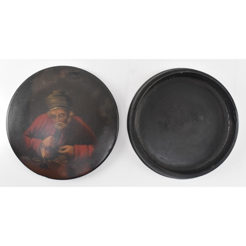 144 - A late 18th - early 19th century hand painted papier mache lacquered snuff box. The circular box pai... 