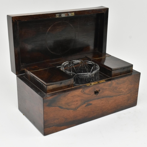 145 - An early 19th century rosewood tea caddy box of rectangular form. The hinged cover opening to reveal... 