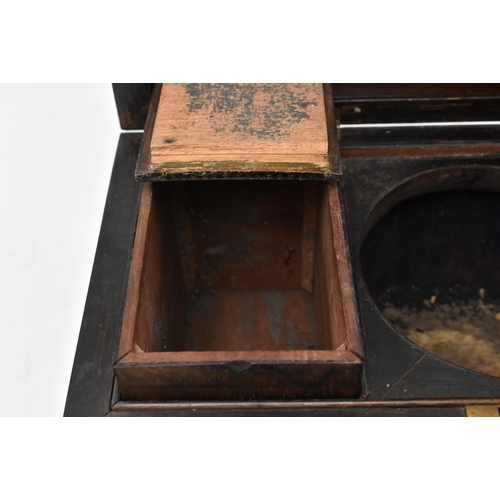 145 - An early 19th century rosewood tea caddy box of rectangular form. The hinged cover opening to reveal... 