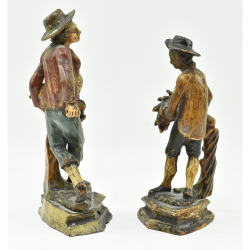 146 - A pair of early 20th century Dutch hand carved wooden figurines. Each hand painted, modelled wearing... 