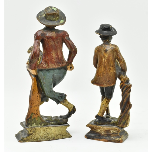 146 - A pair of early 20th century Dutch hand carved wooden figurines. Each hand painted, modelled wearing... 