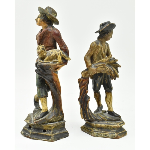 146 - A pair of early 20th century Dutch hand carved wooden figurines. Each hand painted, modelled wearing... 