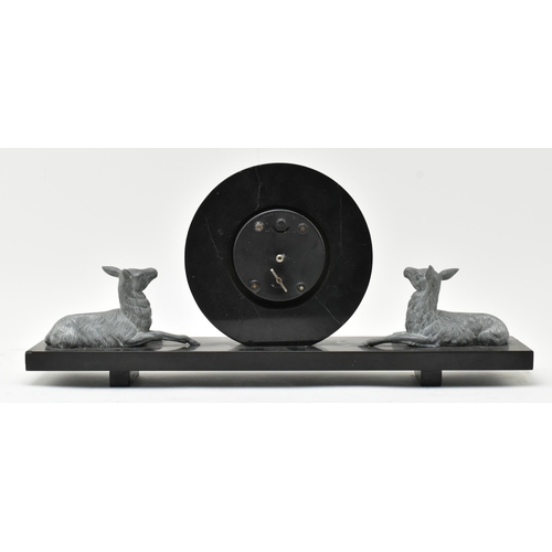 159 - An early 20th century Art Deco marble & slate mantel clock with deers. The clock having a circul... 