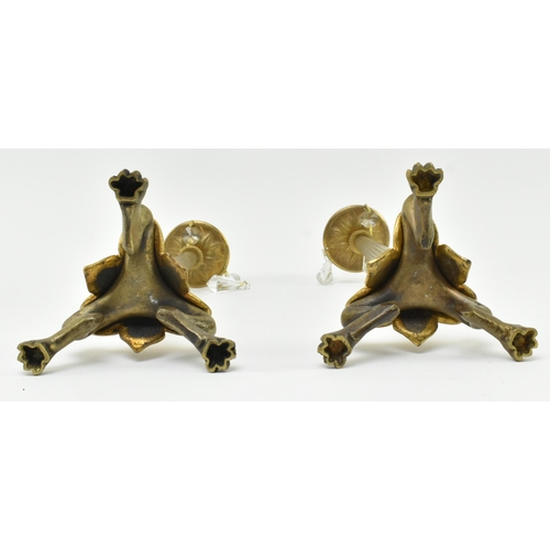 161 - A pair of French Empire 19th century brass & glass candlesticks. Each candlestick having a shape... 