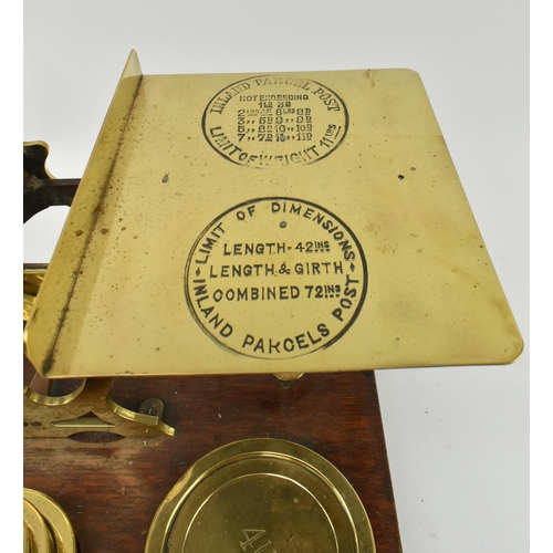 162 - S. Mordan & Co, London - A pair of early 20th century brass & oak wood postal scales. Each w... 