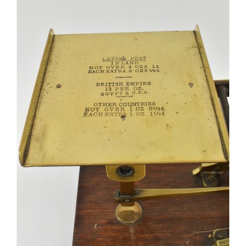 162 - S. Mordan & Co, London - A pair of early 20th century brass & oak wood postal scales. Each w... 