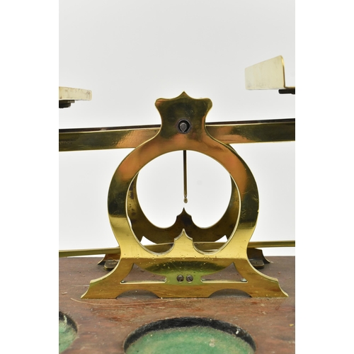 162 - S. Mordan & Co, London - A pair of early 20th century brass & oak wood postal scales. Each w... 