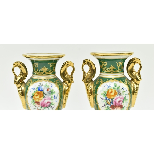 178 - La Tellac a Paris - a pair of early 20th century porcelain figural urns. Each urn with gilded flared... 