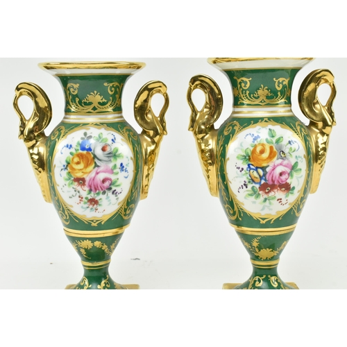 178 - La Tellac a Paris - a pair of early 20th century porcelain figural urns. Each urn with gilded flared... 