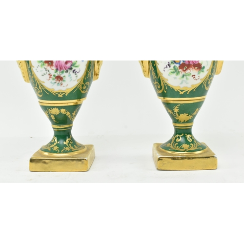 178 - La Tellac a Paris - a pair of early 20th century porcelain figural urns. Each urn with gilded flared... 