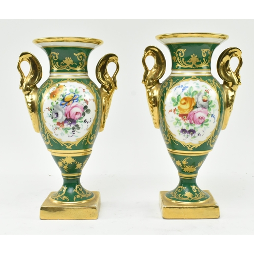 178 - La Tellac a Paris - a pair of early 20th century porcelain figural urns. Each urn with gilded flared... 